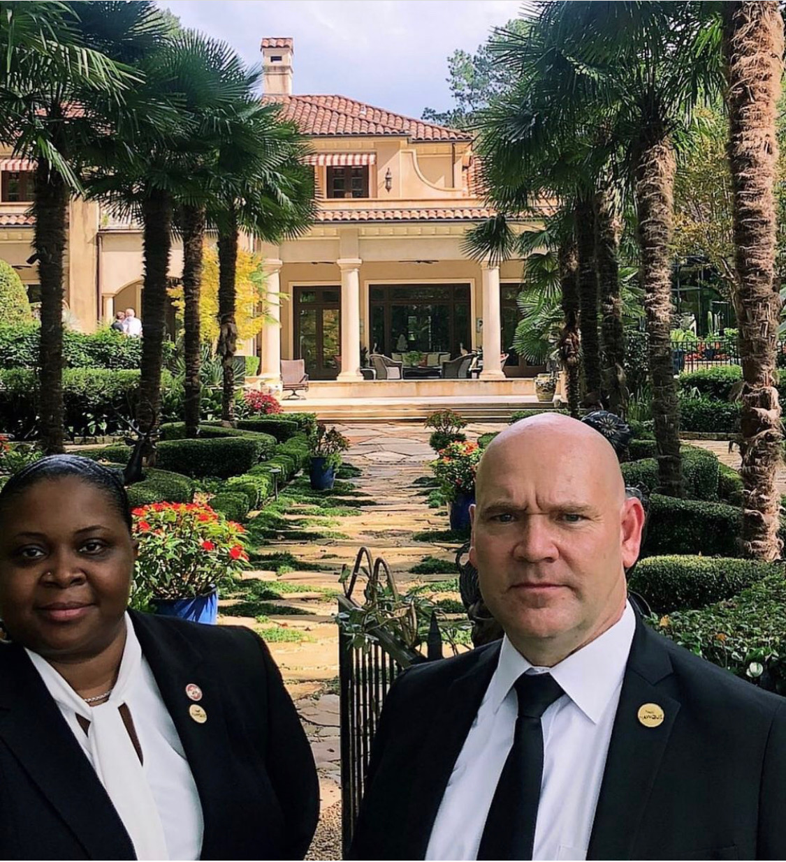 Two Hawque protection professionals positioned outside a private residence during an estate security assignment.