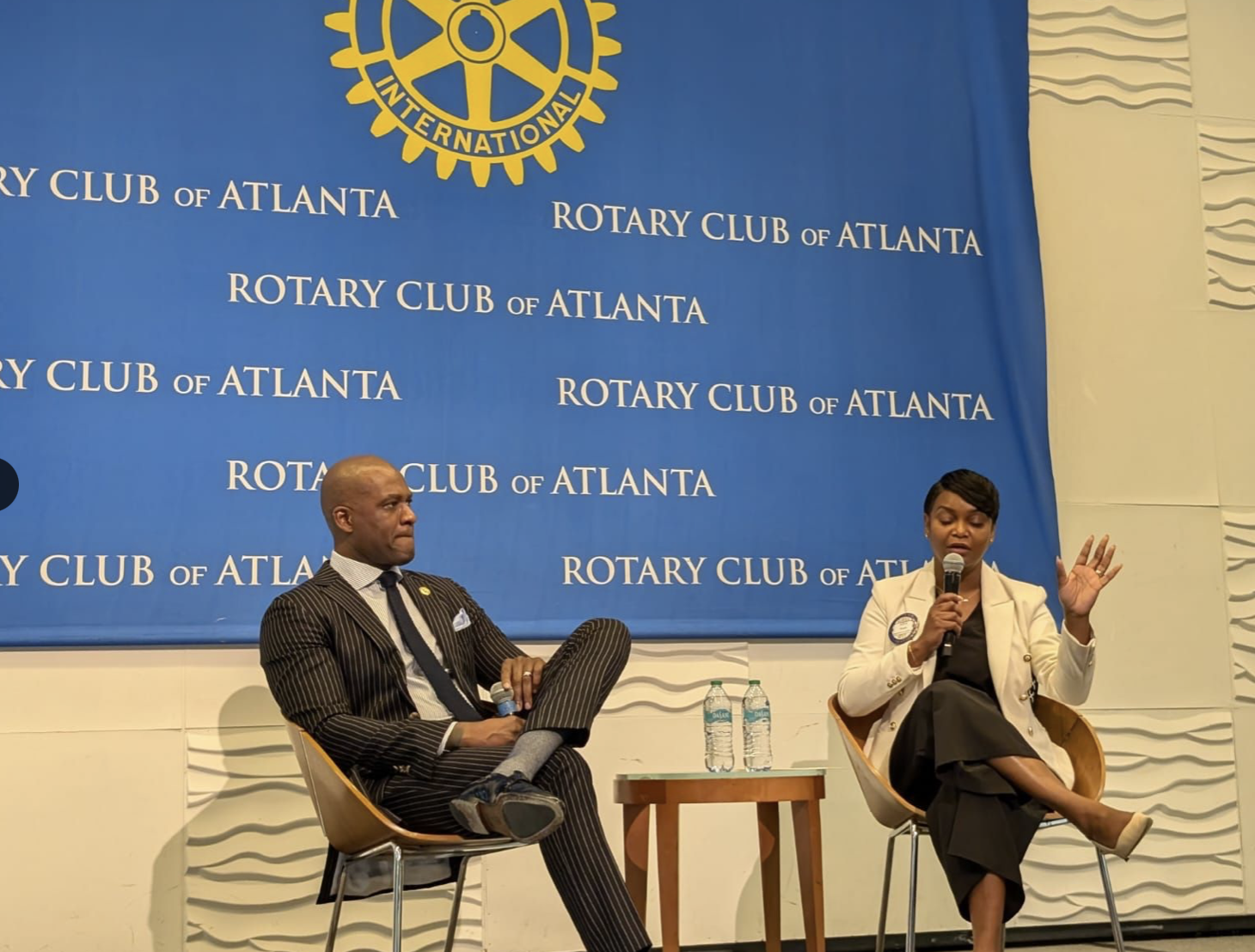 Chris Rich and Anna Roach in conversation onstage at the Rotary Club of Atlanta.